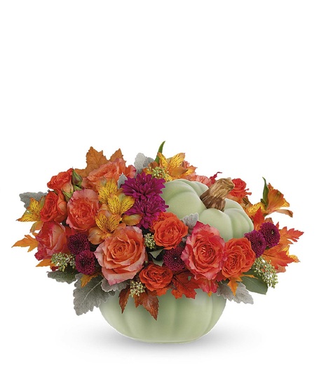 fall toned flowers in rustic bowl