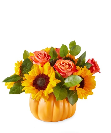 classic sunflowers and orange roses in pumpkin shaped container