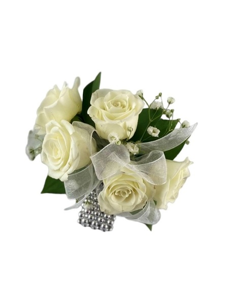 prom corsage with white ribbon and white spray roses with baby's breath