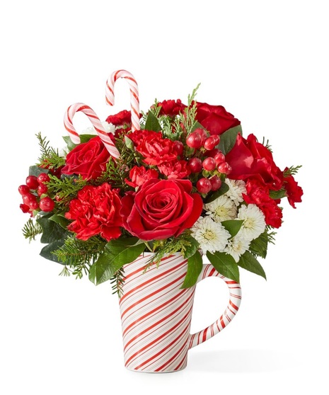christmas floral arrangement with cheerful ornament container