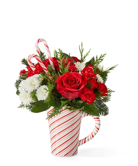 christmas floral arrangement with cheerful ornament container