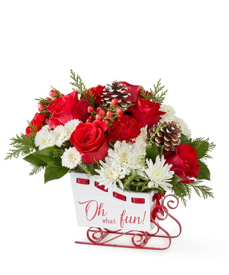 flowers in sleigh shaped container