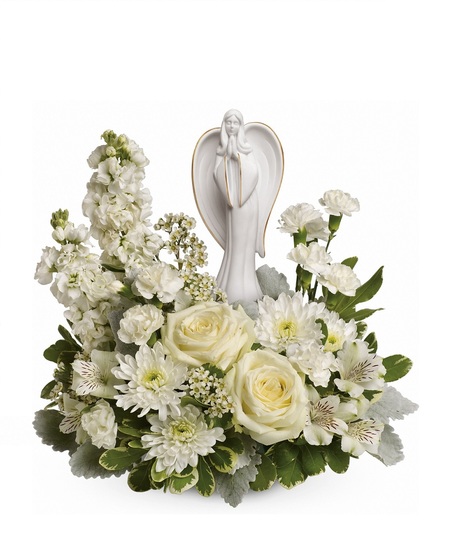 Funeral arrangement of white flowers and greenery in an elegant basket.