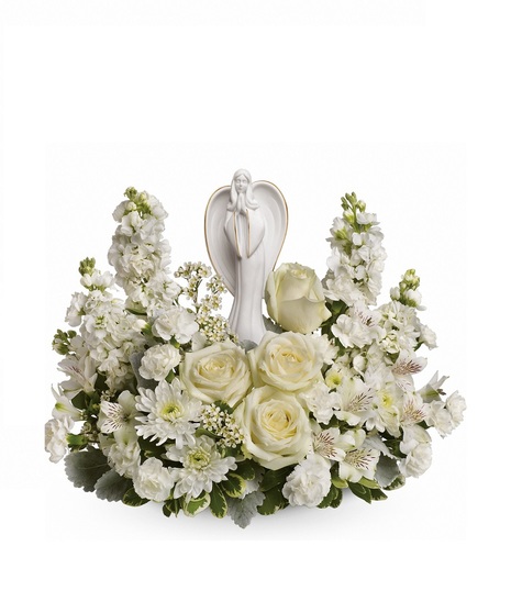 Funeral arrangement of white flowers and greenery in an elegant basket.