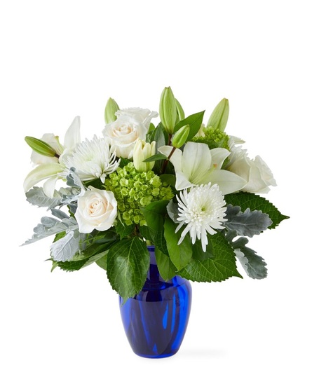snowy dream white flowers in blue vase